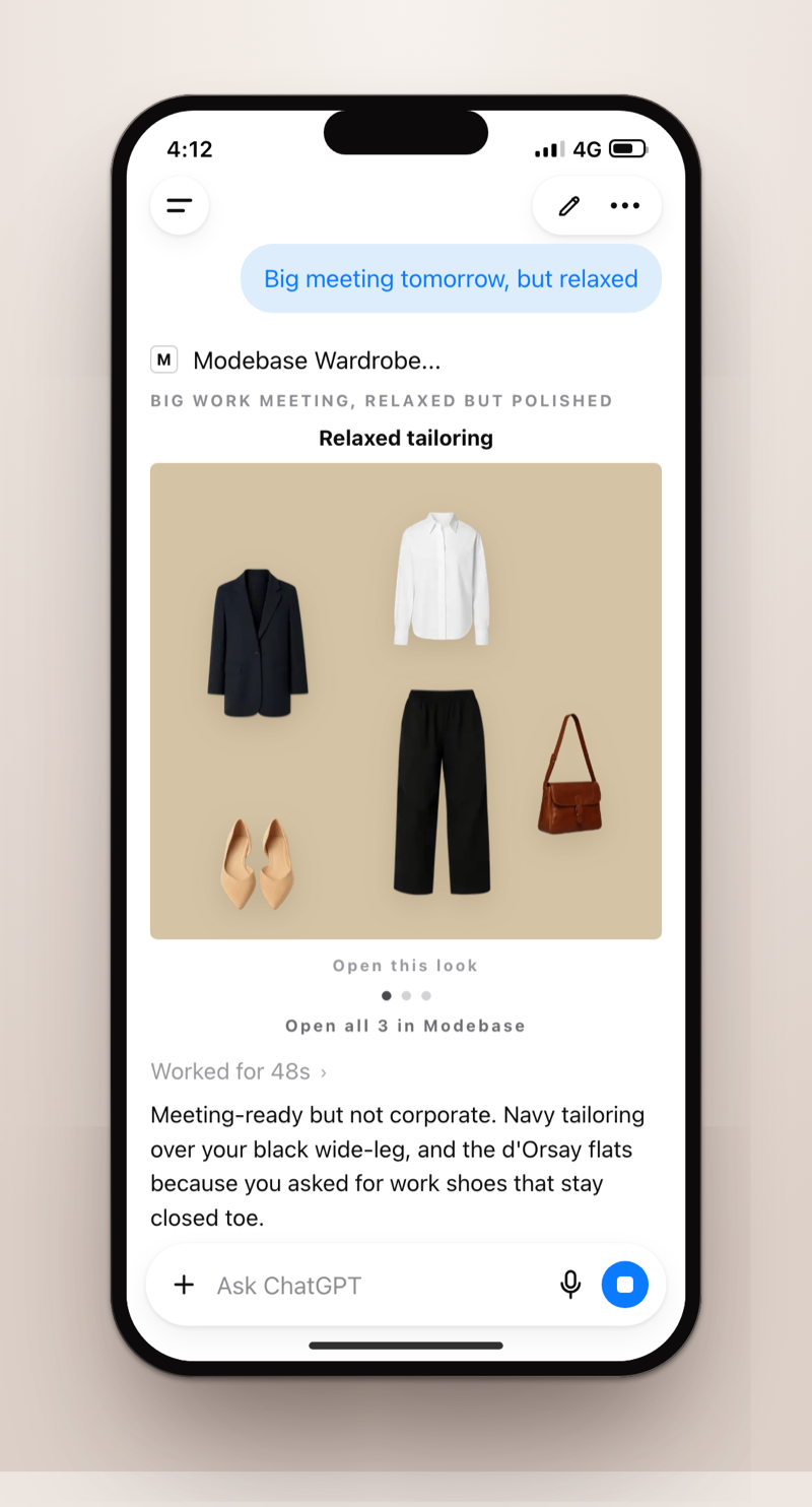 A phone screenshot of ChatGPT answering 'Big meeting tomorrow, but relaxed' with a Modebase Wardrobe outfit card: navy blazer, white shirt, black wide-leg trousers, tan shoulder bag and nude flats, and a note explaining why it picked them