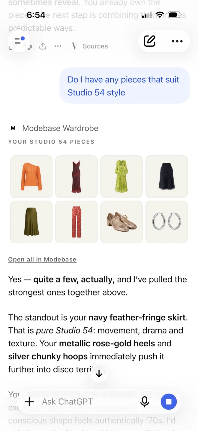 A ChatGPT chat asking which pieces suit Studio 54 style, showing eight pieces from the wardrobe: an orange off the shoulder knit, a burgundy lace slip dress, a green print dress, a navy feather fringe skirt, an olive satin skirt, red floral trousers, metallic rose gold block heel shoes and silver hoop earrings